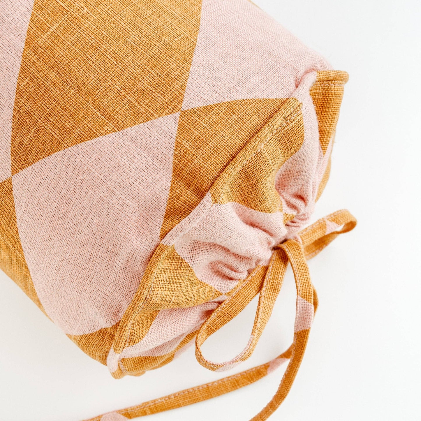 Harlequin linen bolster, mustard/peach