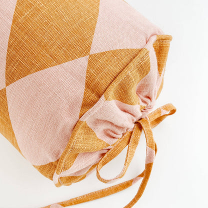 Harlequin linen bolster, mustard/peach