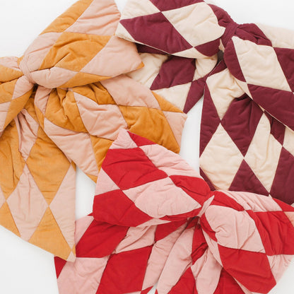 Harlequin cord patchwork bow, claret/cream